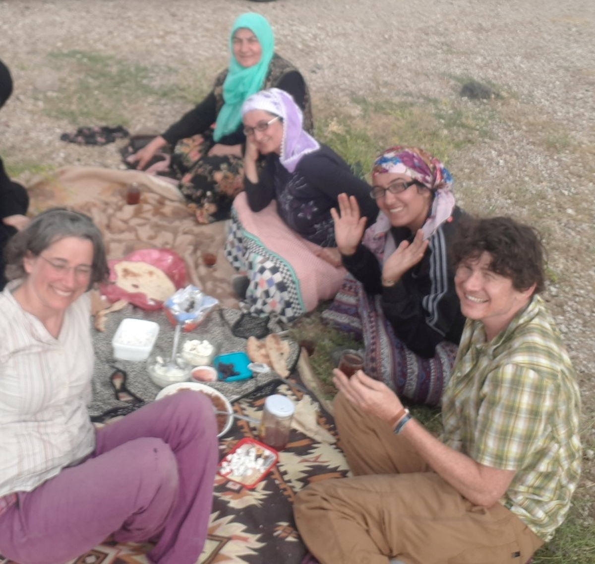 The last day before Iran had crazzy headwinds and minimal sunlight, but our day was made when we saw some women picking herbs in a field who waved frantically when we rode passed. They later pulled over ahead of us in a van and gave a full picnic spread on the grass, with flatbread, cheese, honey, and rosehip jam. The father who isn't in this picture turned out to be quite a joker, and we had a great time exchanging stories through phone translations.